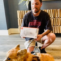 man and dog taking picture
